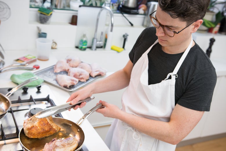 Man cooking in a kitchen.
